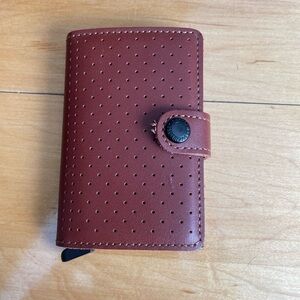 Secrid wallet leather snap closure